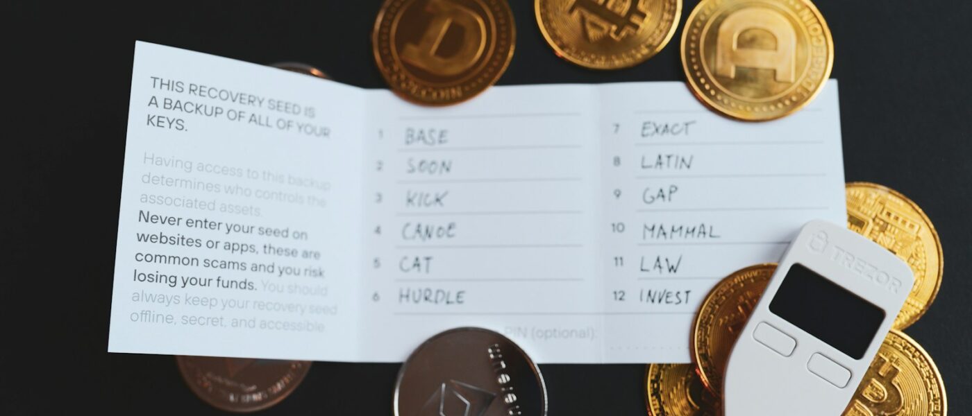 a cell phone sitting on top of a pile of coins