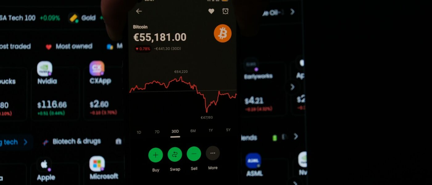 A person holding a cell phone in their hand