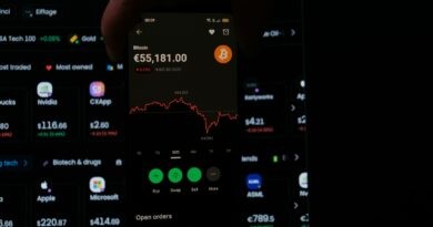 A person holding a cell phone in their hand