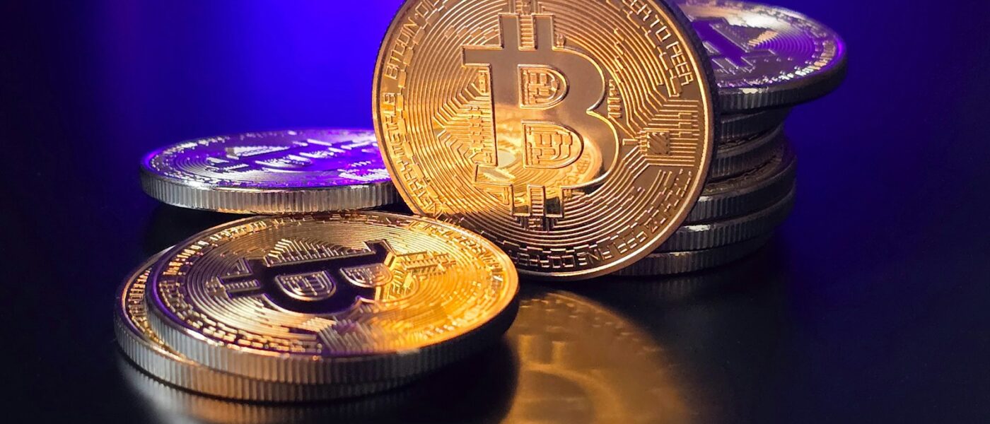 a pile of bitcoins sitting on top of a table