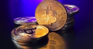 a pile of bitcoins sitting on top of a table