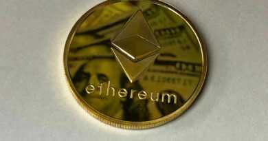 Close-up of a shining Ethereum coin reflecting a dollar bill, symbolizing digital currency and wealth.
