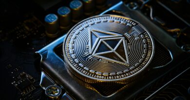 a close up of a computer chip with a symbol on it