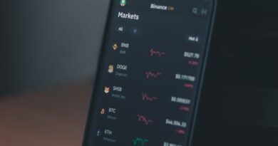 a cell phone sitting on top of a wooden table