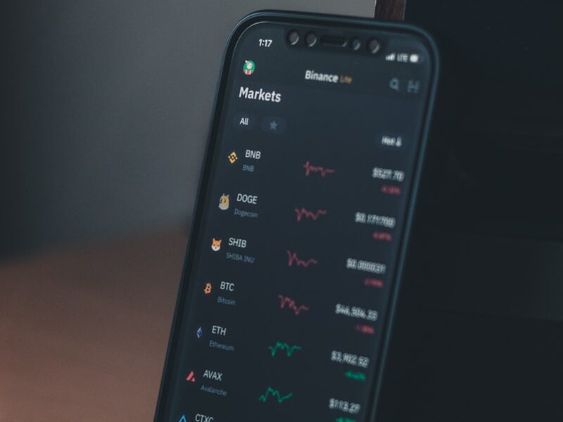 a cell phone sitting on top of a wooden table