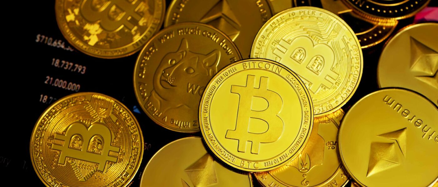 a pile of gold bitcoins sitting on top of each other