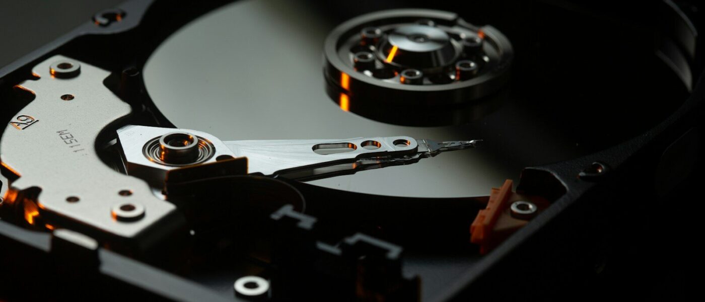 black and silver turntable on brown wooden table