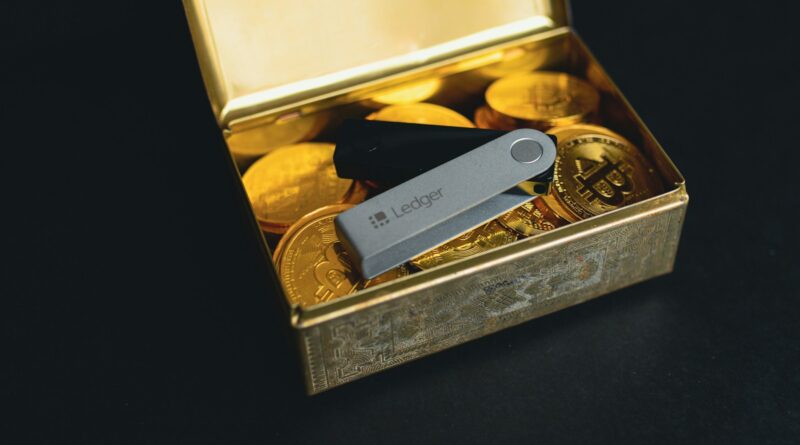a swiss army knife sitting in a box of gold coins