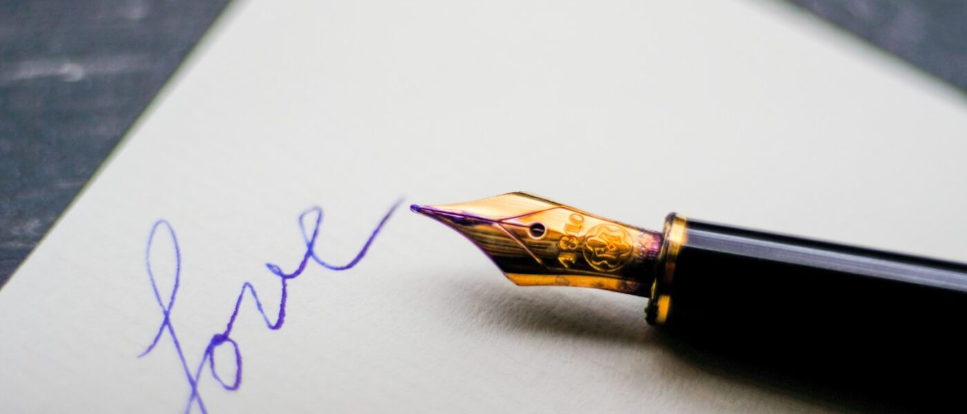 black fountain pen on white paper