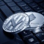 silver and black round analog watch