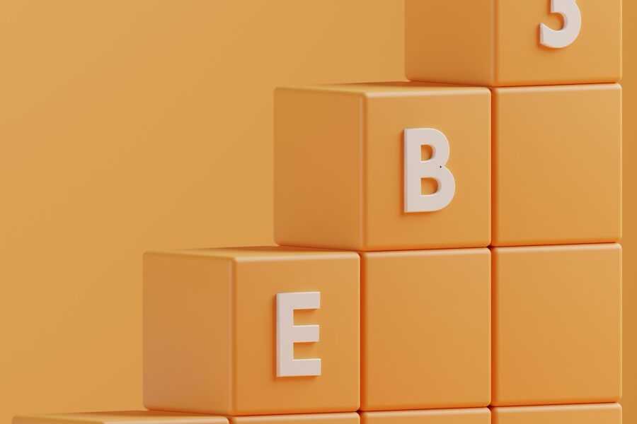a 3d rendering of a pyramid of blocks with the letters e, b, e