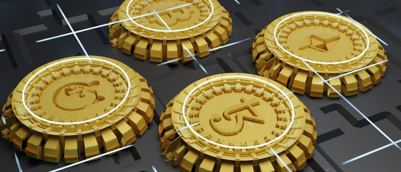 three gold coins with a picture of a man on one of them