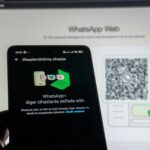 Phone scanning whatsapp web qr code on screen