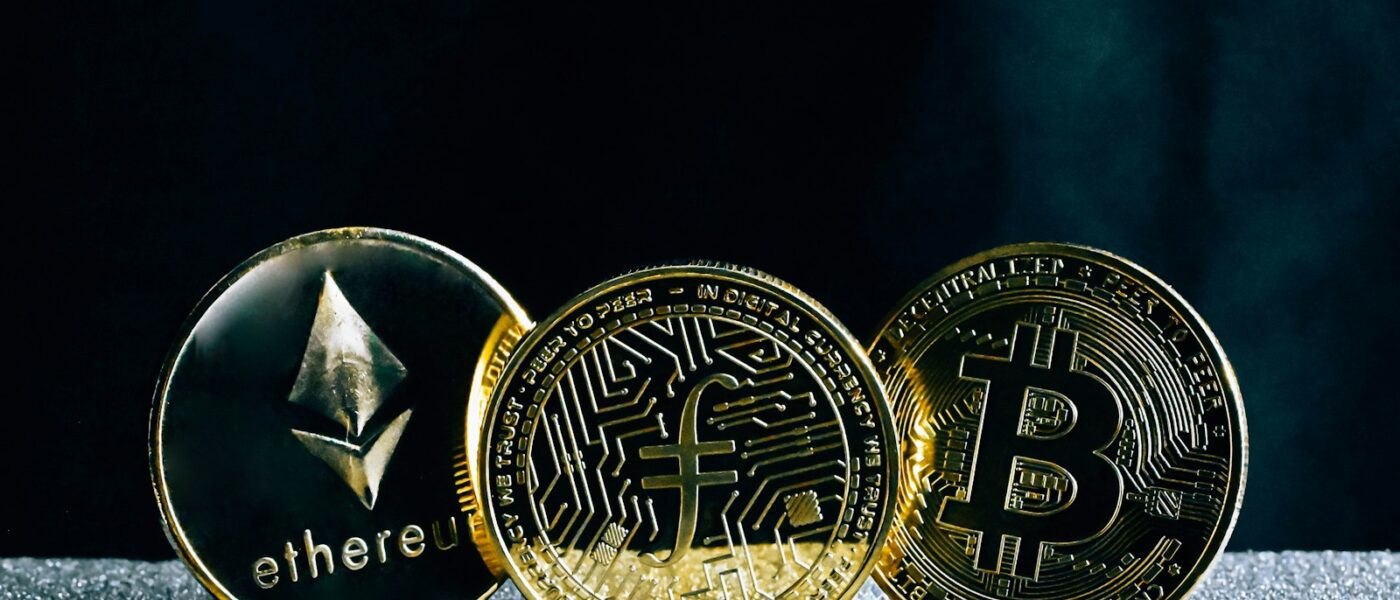 three bitcoins sitting on top of a table