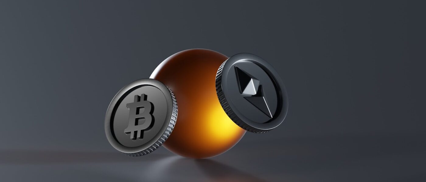 a bitcoin and a lite up coin on a table